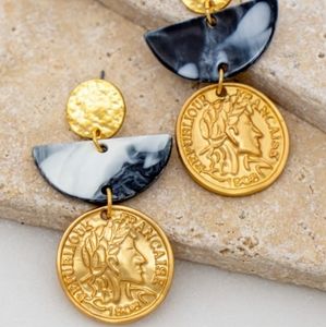 Coin and half moon blue tie dye resin earrings.